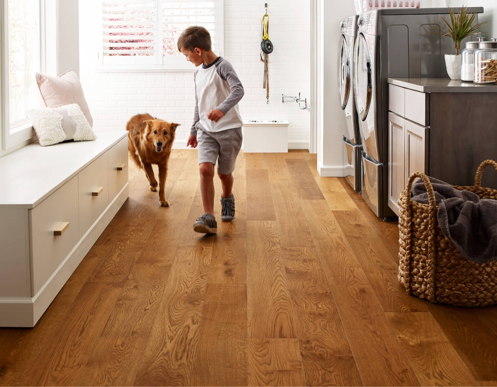boy with a dog on durable flooring in a home | Rice's More Than Floors | Marshfield, WI