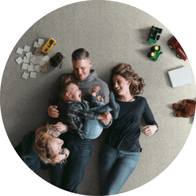 Happy family doing fun on carpet floor