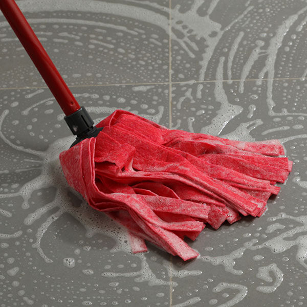 Mopping the floor tiles